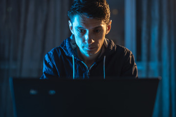 Cybercriminal hacker typing program code while stealing access databases with passwords. Concept of...