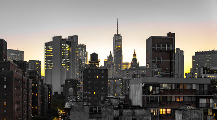 New York City skyline buildings nighttime view with glowing lights in the windows of apartments and...