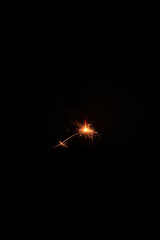 Fototapeta premium yellow sparks on a black background