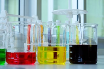Chemical tube set development and pharmacy in laboratory  with multicolored substances in laboratory - Image