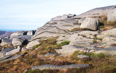 Weathered rock sits on the peak of Slieve Binnian in the Mourne Mountains, Northern Ireland, UK.
