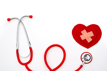 World health day, healthcare and medical concept, red stethoscope and red heart on white background