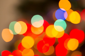 Abstract bokeh background of lights red and orange on a dark