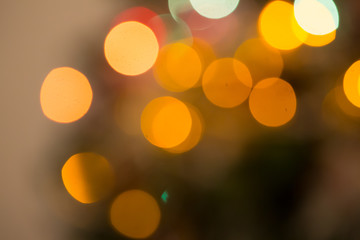 Abstract bokeh background of lights red and orange on a dark