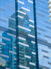 Skyscraper reflections on the windows in
