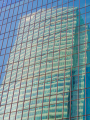 Skyscraper reflections on the windows in