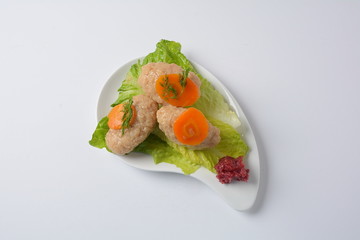 Passover Pesach traditional Jewish food - gefilte fish with, lettuce, carrots, horse radish and matzah. Passover celebration concept