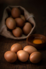 Fresh farm eggs on a wooden rustic background
