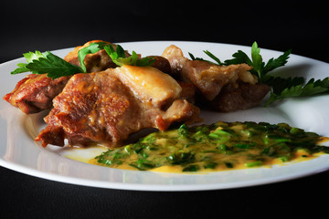 Meat on a white dish with sauce. Healthy food