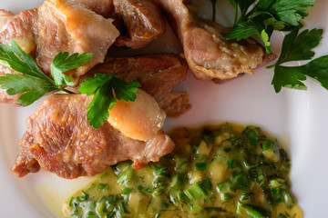 Meat on a white dish with sauce. Healthy food
