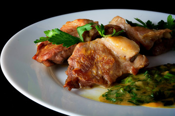 Meat on a white dish with sauce. Healthy food
