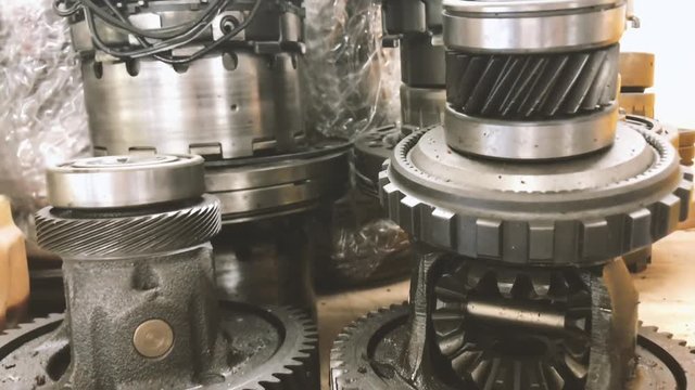 4k establishing cinematic b-roll shot of car spare part engine gearbox 