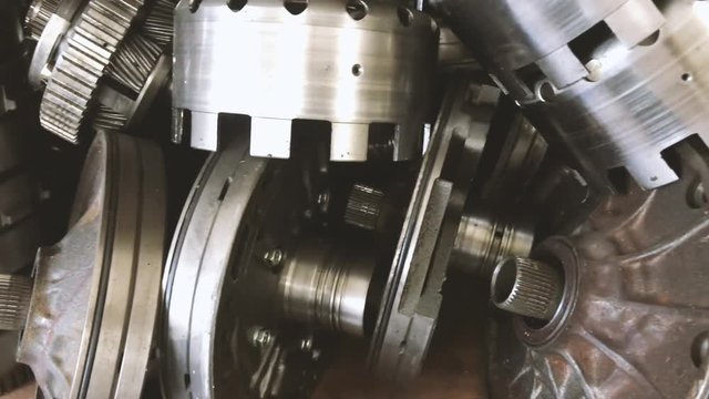 4k establishing cinematic b-roll shot of car spare part engine gearbox 