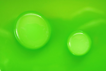 green drop.Round Water drop macro on green background.Pure water concept. Ecology and nature.Water drop phone wallpapers   