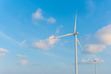 Wind energy converter as wind turbine ecology system clean power with blue sky.