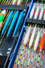 many different fishing floats in the box