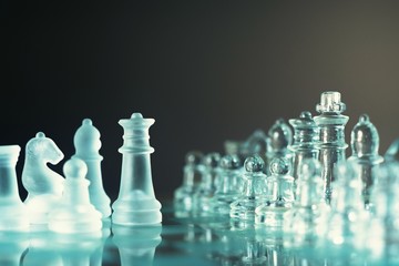 Chess board game made of glass, business competitive concept © sundaemorning