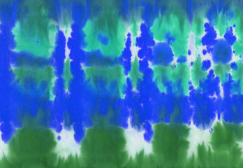 Hand painted abstract spotted colorful tie-dye textile background pattern
