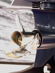 Close up stainless steel motor boat propeller on gear drive shaft of outboard motor - rear side...