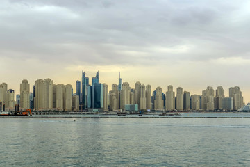 Fototapeta na wymiar Amazing view of Jumeirah Beach Residence and Dubai Marina Waterfront Skyscraper, Residential and Business Skyline in Dubai Marina, United Arab Emirates