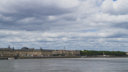 Obraz premium City of Bordeaux under clouds over Garonne River, in Bordeaux, France