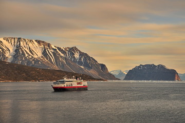 Bright polar sun and icebergs.