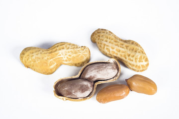 Peanuts in shells on white background.