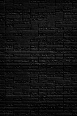 Fototapeta na wymiar Abstract black brick wall texture background. Vertical view of masonry brick wall.
