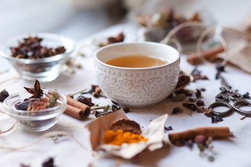 Indian spa, relaxation,  herbal tea ceremony. Dry leaves, spices, cinnamon, anise, curcuma, dry...
