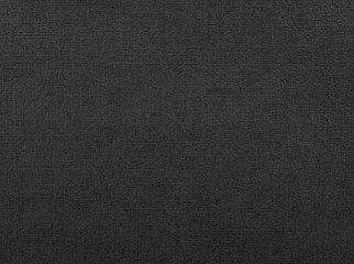Black paper texture. Background of dark material made from cardboard.