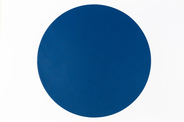 Abstract minimal color paper background. Blue round circle on white background. Top view, flat lay
