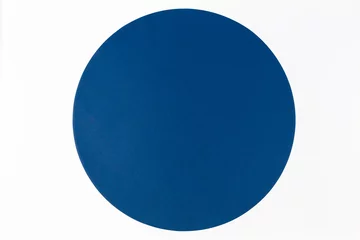 Fotobehang Abstract minimal color paper background. Blue round circle on white background. Top view, flat lay © vejaa