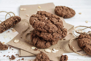 A stack of chocolate cookies on craft paper