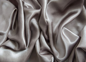 Gray shiny satin material with pleats