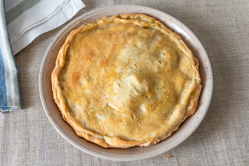 Beautiful fresh homemade round pie, top view - abstract puff pastry pie