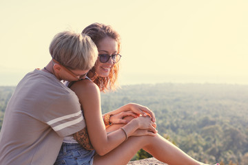 Beautiful lesbian young couple gently lovingly hugging, equal rights for the lgbt community,