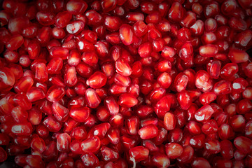 red ripe pomegranate seeds closeup. health food. beautiful background texture of pomegranate fruit seeds