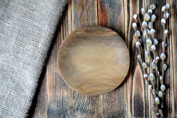 Empty wooden plates on the table Easter table setting rustic style