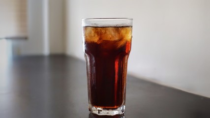 glass of cola with ice