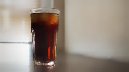 glass of cola with ice