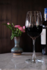 two glasses of red wine on table