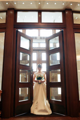 young beautiful bride in the expensive interior, wedding day 1