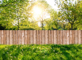 Wooden garden fence at backyard in spring