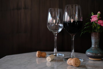 two glasses of white wine on a table
