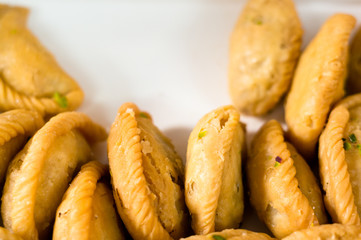 Closeup shot of gujiya , sweet filled delicacy served on holi and diwali