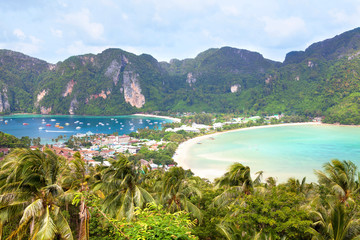 Island beach, palm trees, mountains and bay with boats top view, Phi Phi Island, Thailand
