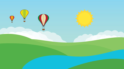 Hot air balloons over a springtime rural landscape