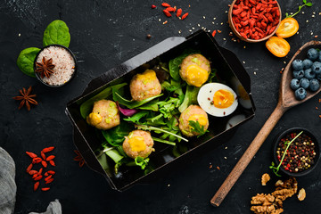 Healthy food and diet concept. Meat balls with egg and vegetables. restaurant dish delivery. Top view. Free space for your text.