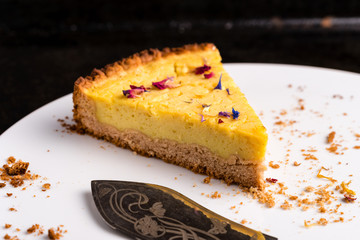 Last piece of a vegan lemon cheesecake - horizontal