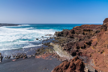 Spain, Lanzarote, Beautiful black sand beach of el golfo and rough sea